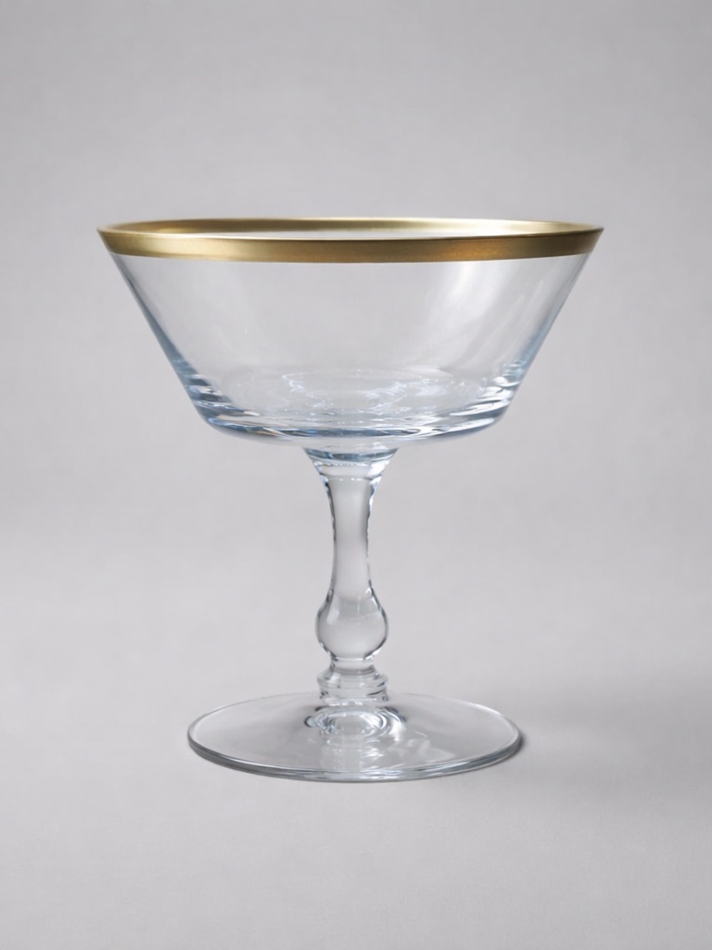7 Signed Vintage Fostoria Crystal Coupe with gold rim.